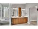 The bathroom features a double sink vanity with modern lighting and a walk-in shower at 1109 Pincay Dr, Henderson, NV 89015