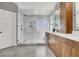 This bathroom features a glass enclosed shower and modern wooden cabinets at 1109 Pincay Dr, Henderson, NV 89015