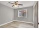 Comfortable bedroom with fresh paint, wood-look floors, neutral decor and large window at 1109 Pincay Dr, Henderson, NV 89015