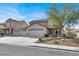 Attractive two-story home with a three-car garage and desert landscaping at 1109 Pincay Dr, Henderson, NV 89015