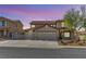 Beautiful two-story home featuring a three car garage and low-maintenance desert landscaping at 1109 Pincay Dr, Henderson, NV 89015