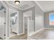 Upstairs hallway with view into bathroom with white cabinets at 1109 Pincay Dr, Henderson, NV 89015