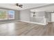 Upstairs living room features a modern chandelier, fresh paint and trim, and new floors at 1109 Pincay Dr, Henderson, NV 89015