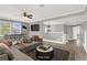 Spacious upstairs living room featuring a sofa and television at 1109 Pincay Dr, Henderson, NV 89015
