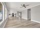 Open-concept living space showcasing new floors, paint, ceiling fan, and seamless flow to the modern kitchen at 1109 Pincay Dr, Henderson, NV 89015