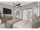 This spacious main bedroom features a sliding barn door leading to the main bathroom at 1109 Pincay Dr, Henderson, NV 89015
