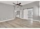 Spacious main bedroom with barn door leading to the bathroom, new floors, and fresh paint at 1109 Pincay Dr, Henderson, NV 89015