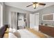 The staged main bedroom features a neutral palette, hardwood floors, a walk-in closet, and decor at 1109 Pincay Dr, Henderson, NV 89015