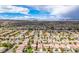 Expansive aerial view of a neighborhood highlighting mountain views at 11091 Parete Ct, Las Vegas, NV 89141