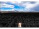 Expansive aerial view of a neighborhood highlighting mountain views at 11091 Parete Ct, Las Vegas, NV 89141