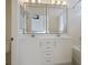 Bright bathroom featuring double sinks, stylish mirrors and vanity with updated fixtures at 11091 Parete Ct, Las Vegas, NV 89141