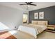Bedroom with neutral tones, hardwood flooring, and modern decor at 11091 Parete Ct, Las Vegas, NV 89141
