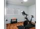 Bright exercise room with wood flooring, equipment, and natural light at 11091 Parete Ct, Las Vegas, NV 89141