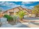 Charming home with a well-maintained lawn and a two-car garage, perfect for a Gathering at 11091 Parete Ct, Las Vegas, NV 89141