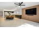 Open kitchen features a large island with barstool seating and stainless steel appliances at 11091 Parete Ct, Las Vegas, NV 89141