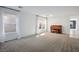 Spacious living room featuring neutral carpet and a classic piano at 11091 Parete Ct, Las Vegas, NV 89141