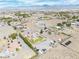 Expansive aerial view of a desert home with a sparkling blue pool and mountain views at 1131 China St, Pahrump, NV 89048