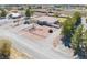 An aerial view shows a house with a long driveway and desert landscaping at 1131 China St, Pahrump, NV 89048