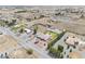 An aerial view shows a house with a pool, ample parking, desert landscaping, and mountain backdrop at 1131 China St, Pahrump, NV 89048