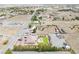 A charming single-Gathering desert home features a lush green backyard, a sparkling blue pool, and ample parking at 1131 China St, Pahrump, NV 89048