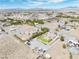 This desert property includes a private pool, a lush yard, and large parking area, all set in a beautiful landscape at 1131 China St, Pahrump, NV 89048