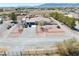 Bird's eye view of a single Gathering home, driveway, and landscaped desert landscape at 1131 China St, Pahrump, NV 89048