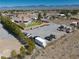 Expansive property featuring desert landscaping, multiple parking areas, outbuildings, and potential for various outdoor activities at 1131 China St, Pahrump, NV 89048