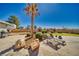 Backyard with a rock garden, outdoor seating area, and grill at 1131 China St, Pahrump, NV 89048
