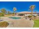 Serene backyard with desert landscaping, artificial turf, private pool, and covered patio, creating an oasis at 1131 China St, Pahrump, NV 89048