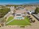 Private backyard oasis with a beautiful pool, well-maintained artificial turf, and desert landscape, great for outdoor living at 1131 China St, Pahrump, NV 89048