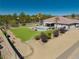 Inviting backyard with a sparkling pool, lush faux grass, and desert landscaping, creating a serene outdoor retreat at 1131 China St, Pahrump, NV 89048