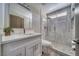Modern bathroom features a glass shower door, and white single sink vanity at 1131 China St, Pahrump, NV 89048