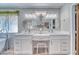Bright bathroom showcasing double sinks, overhead lighting, and decorative wall hangings at 1131 China St, Pahrump, NV 89048