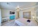 Spacious bedroom featuring laminate flooring, ceiling fan, tv and closet at 1131 China St, Pahrump, NV 89048