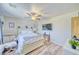 Bright bedroom with chair, white furniture, laminate flooring, and ample natural light at 1131 China St, Pahrump, NV 89048