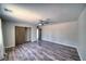 Spacious bedroom showcasing wood-look floors, neutral paint, ceiling fan, and closet with sliding doors at 1131 China St, Pahrump, NV 89048
