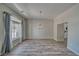 Open dining room featuring wood flooring, large window, and chandelier lighting fixture at 1131 China St, Pahrump, NV 89048
