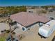 Spacious single-story home with a tile roof, desert landscaping, and ample parking space for vehicles and recreational vehicles at 1131 China St, Pahrump, NV 89048