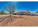 Lovely single-story home showcasing a manicured front yard, three-car garage, and a welcoming entrance with columns at 1131 China St, Pahrump, NV 89048