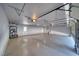 Large three car garage featuring sealed concrete floor and overhead lighting at 1131 China St, Pahrump, NV 89048