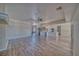 Open concept living room showcasing wood flooring, a ceiling fan, and modern design at 1131 China St, Pahrump, NV 89048