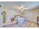 Relaxing primary bedroom featuring ceiling fan, laminate floors and ample natural light at 1131 China St, Pahrump, NV 89048