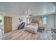 Spacious main bedroom with neutral tones, natural light, ceiling fan, and ensuite bathroom at 1131 China St, Pahrump, NV 89048