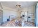 Spacious home office with wood-look floors, a large desk, storage solutions, and plenty of natural light at 1131 China St, Pahrump, NV 89048