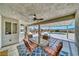 Comfortable covered patio area with ceiling fan and backyard views; an ideal spot for dining at 1131 China St, Pahrump, NV 89048