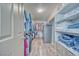 Walk-in closet featuring hardwood floors, shelving, and hanging storage space at 1131 China St, Pahrump, NV 89048