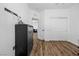 Cozy bedroom featuring wood-look floors, a dresser, and convenient closet space at 11826 Corenzio Ave, Las Vegas, NV 89138