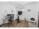 Bright bedroom with a dedicated workspace including a desk, chair, and computer setup at 11826 Corenzio Ave, Las Vegas, NV 89138