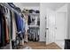 Walk-in closet with ample storage and well-organized clothing racks and shelves at 11826 Corenzio Ave, Las Vegas, NV 89138