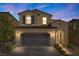 Charming two-story home boasts a neutral color palette, tile roof, and a paved driveway and walkway at 11826 Corenzio Ave, Las Vegas, NV 89138